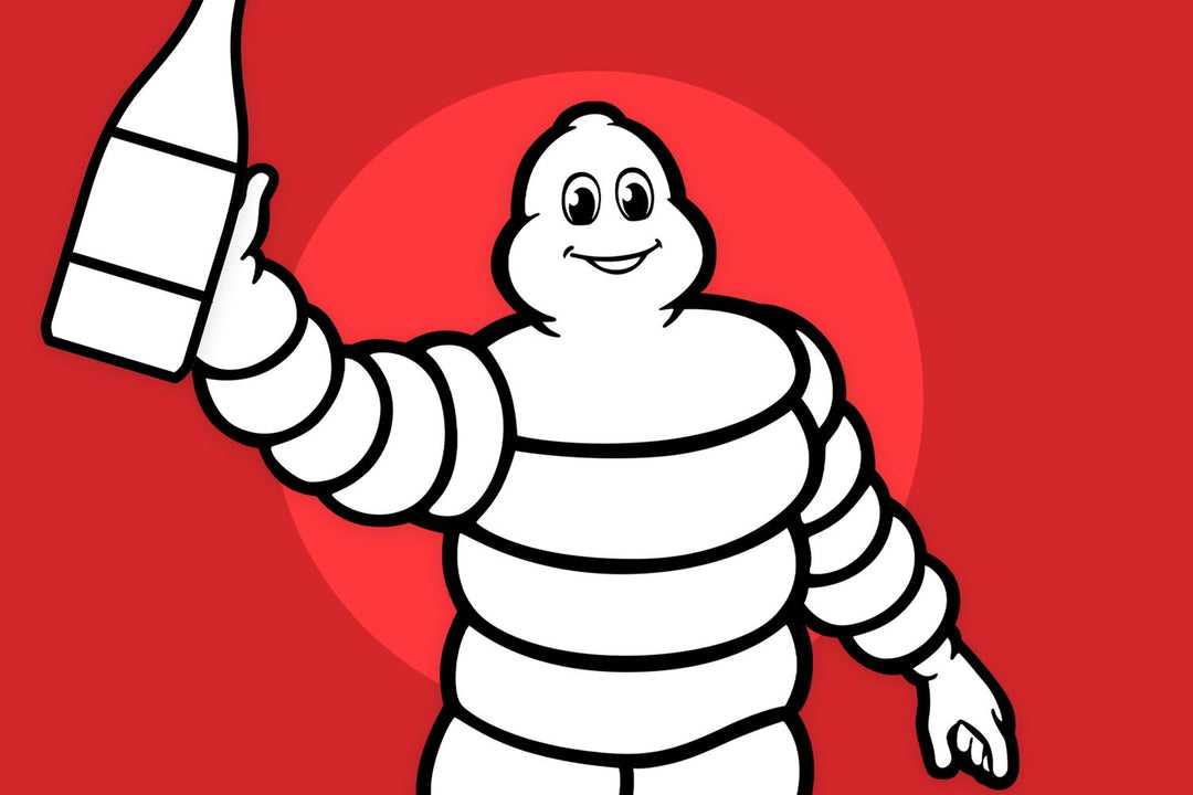 Michelin Man holding a bottle of wine